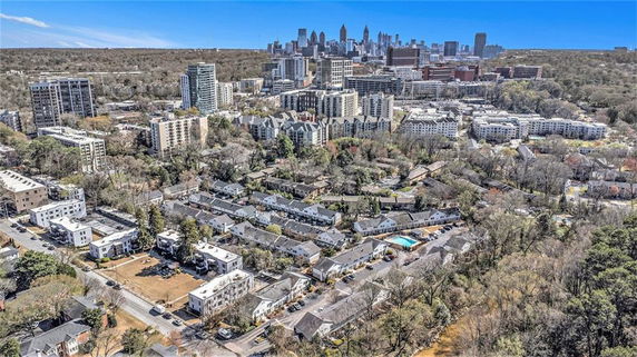 Panoramic view of a cityscape with high-rise buildings and residential areas.