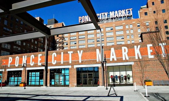 Front view of a large brick building with signage for Ponce City Market.