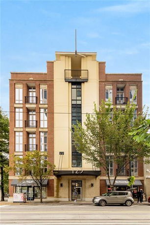 Front view of a multi-story building with a modern facade.