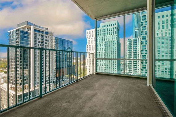 Panoramic view from a high-rise building overlooking surrounding skyscrapers.