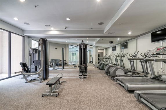Indoor gym area with exercise equipment and treadmills.