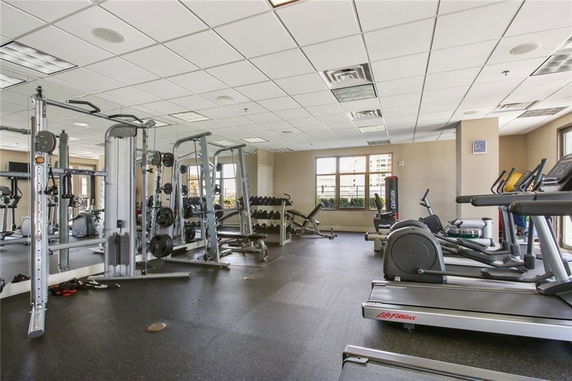 Interior view of a gym area with various exercise equipment.
