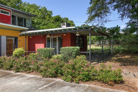 Front view of a house with a covered porch area.