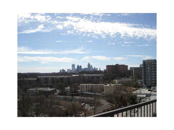 Panoramic view of the city skyline and surrounding buildings seen from a high vantage point.