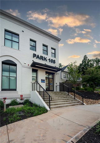 Front view of a two-story building labeled 'Park 108'.