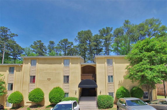 Front view of a two-story building with multiple windows and a central entrance.