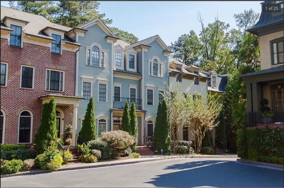 Front view of a row of three-story townhouses.
