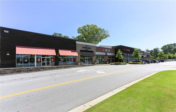 Front view of a one-story commercial building with multiple storefronts.