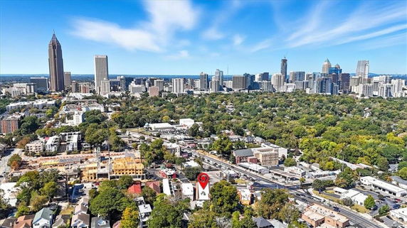 Wide aerial view of a city with skyscrapers and residential areas.