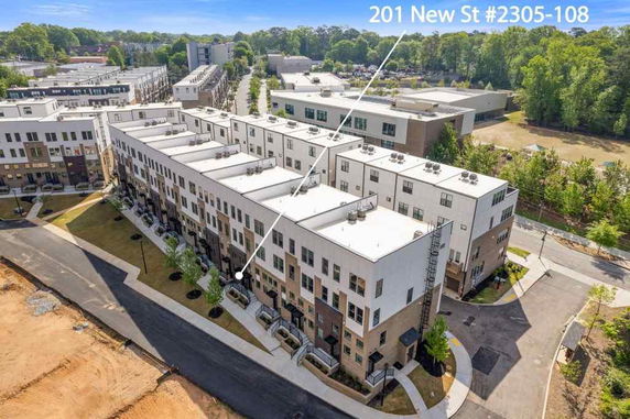 Aerial view of a modern multi-story apartment building complex.