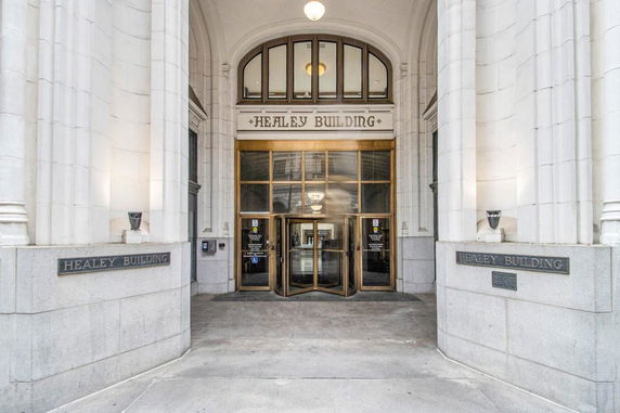 Front entrance of the Healey Building with revolving doors.