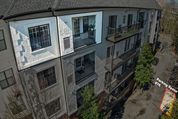 Front view of a multi-story residential building with balconies.