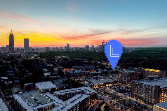 Panoramic view of a city skyline during sunset.