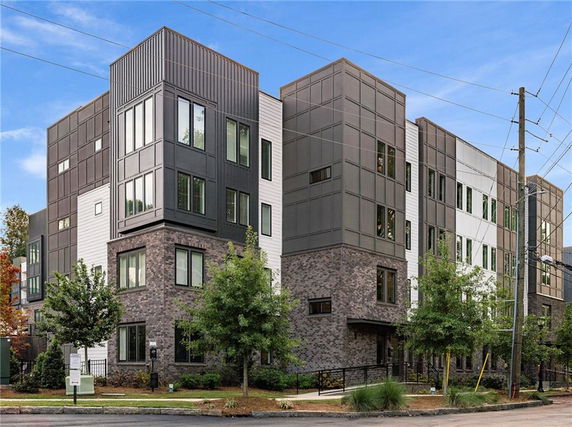 Front view of a multi-story modern apartment building.