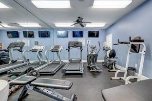 Indoor gym area with treadmills and exercise equipment.