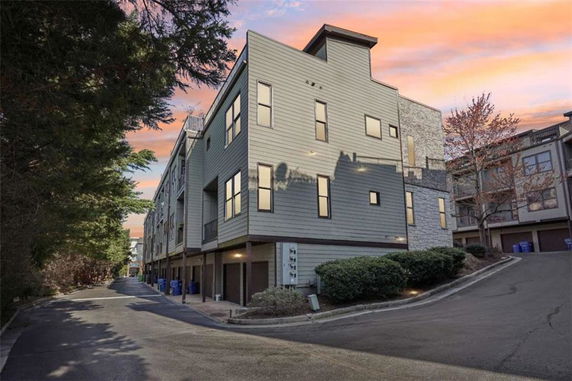 Front view of a multi-story residential building with modern design.