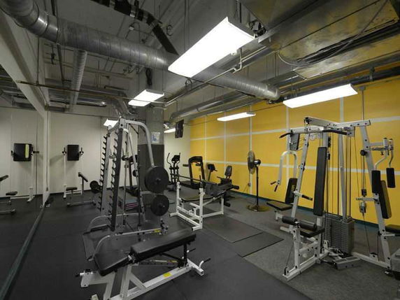 Indoor gym area with various exercise equipment.