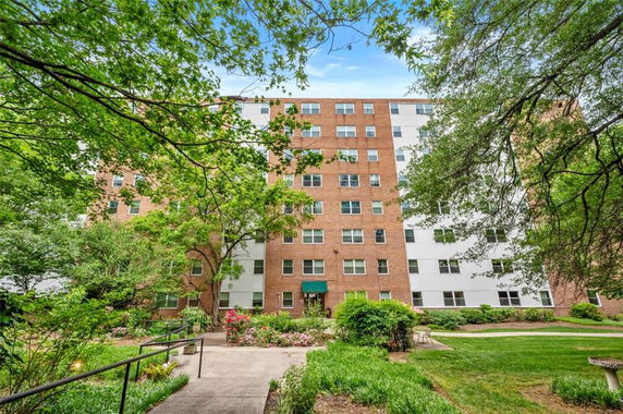 Front view of a multi-story apartment building.