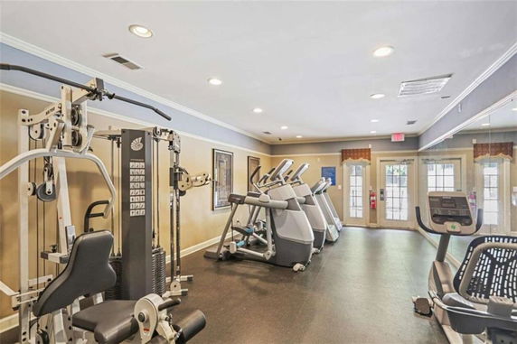 Gym area equipped with exercise machines and cardio equipment.