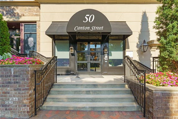 Front view of a building entrance with steps and a canopy labeled 'Canton Street'.