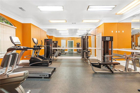 Indoor gym area with fitness equipment.