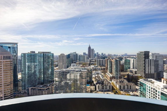 Panoramic view of a cityscape with multiple skyscrapers and buildings.