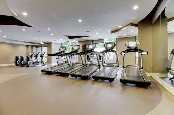 Indoor gym area with treadmills and exercise equipment.