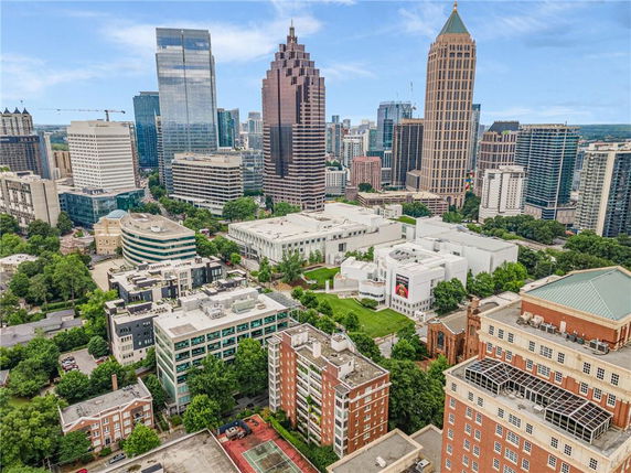 Panoramic view of a cityscape with multiple high-rise buildings.