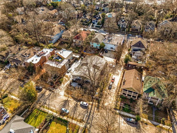 Aerial view of a suburban neighborhood with houses and trees.