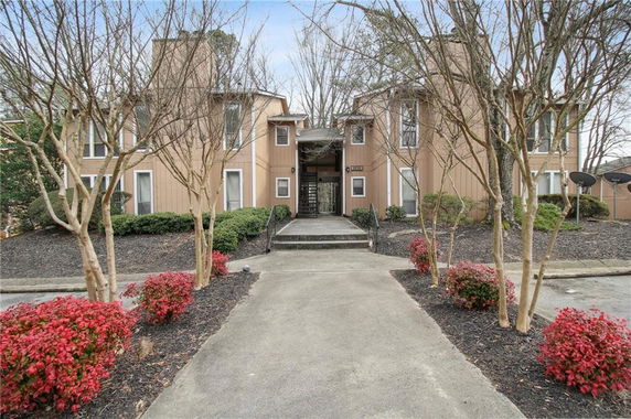 Front view of a two-story building with multiple entrances.