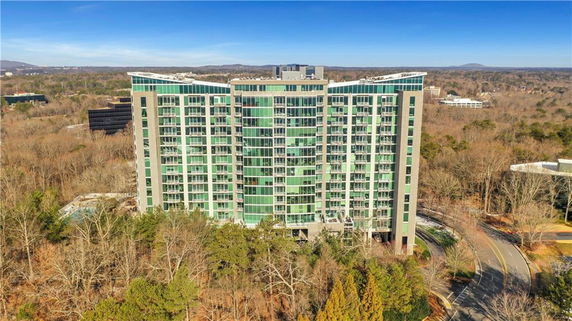 Front view of a multi-story building with a modern glass facade.