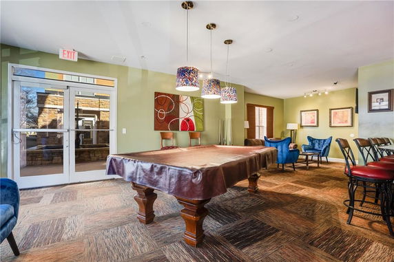 Recreation area with a pool table and seating