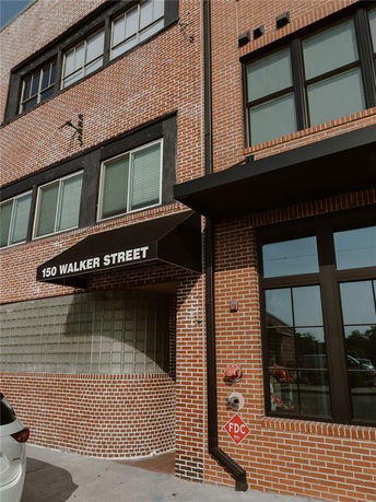 Front view of a brick building at 150 Walker Street.