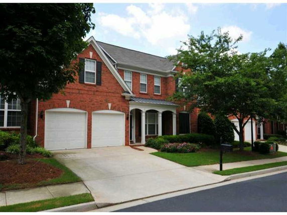 Front view of a two-story house with a double garage.