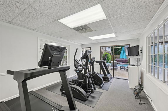 Indoor gym area with treadmills and exercise equipment.