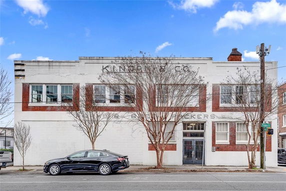 Front view of a two-story commercial building with brick accents.