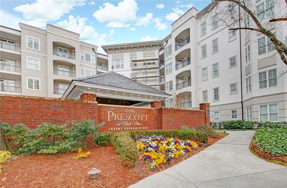 Front view of a multi-story luxury condominium building.