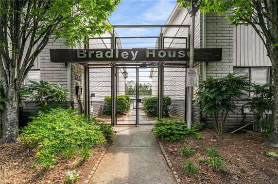 Front view of a building entrance with a sign reading 'Bradley House'.
