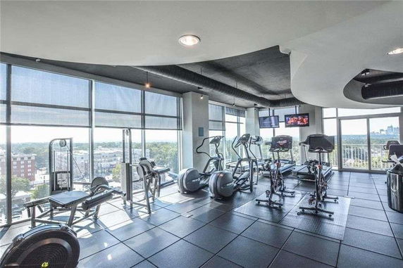 Interior view of a gym area with exercise equipment.