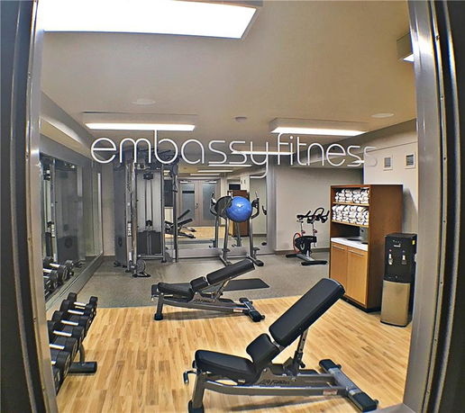 View of a fitness area with gym equipment and exercise machines.