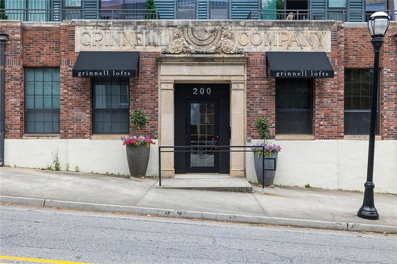 Front view of a brick building with grinnell company signage.