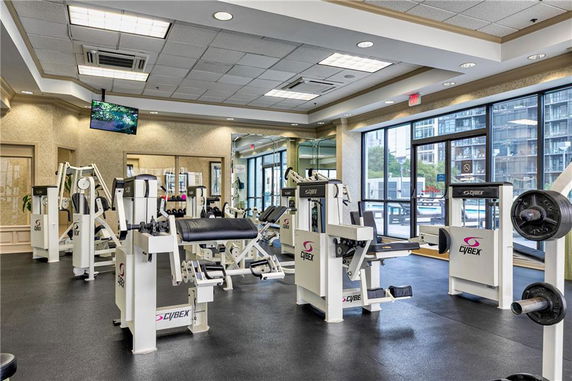 Interior view of a fitness center with various gym equipment.