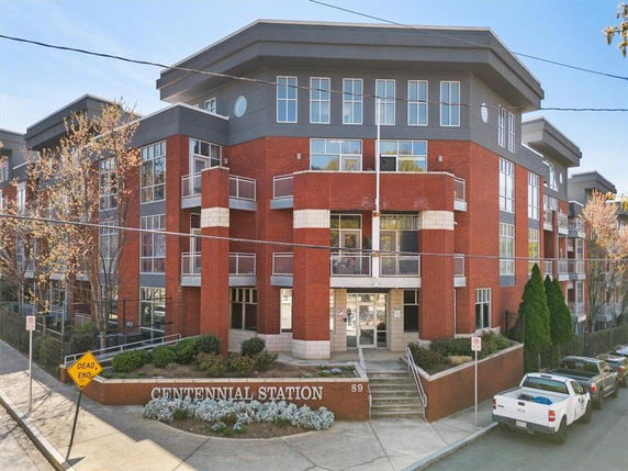 Front view of a multi-story building with modern architectural design.