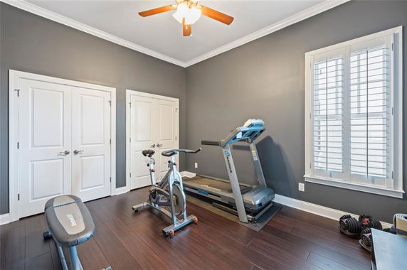 Indoor room with gym equipment including a treadmill and exercise bike.