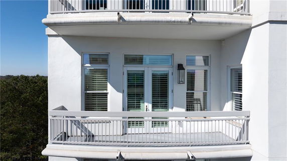 Outdoor balcony view of a multi-story building.