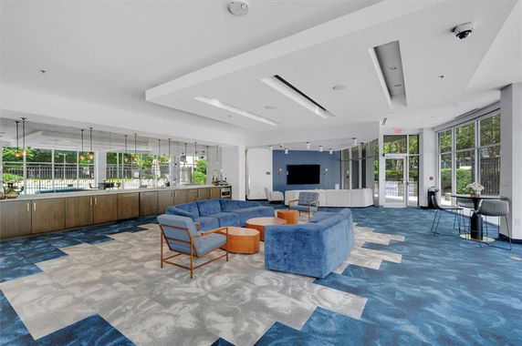Indoor recreation area with modern seating and entertainment setup.