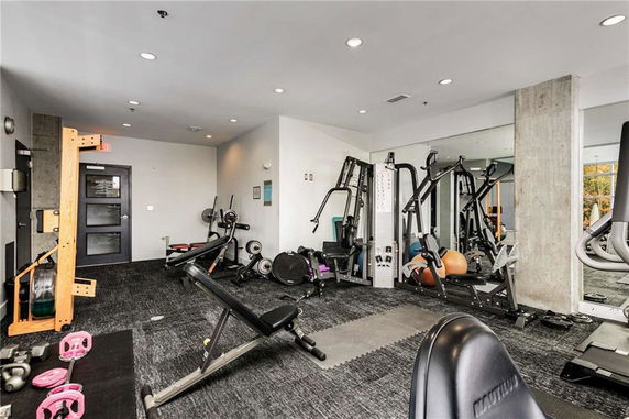 Interior view of a gym with various exercise equipment.