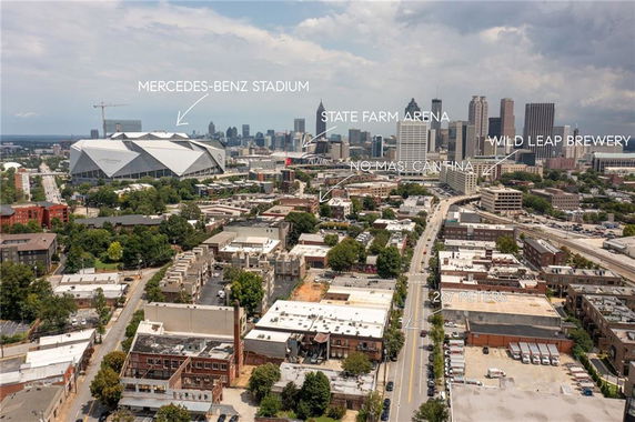 Panoramic view of a city skyline with labeled landmarks.
