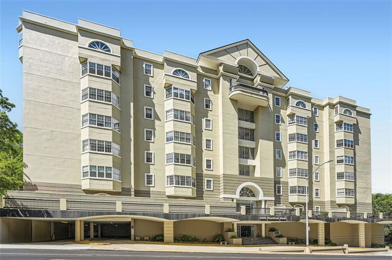 Front view of a multi-story residential building with a modern design.