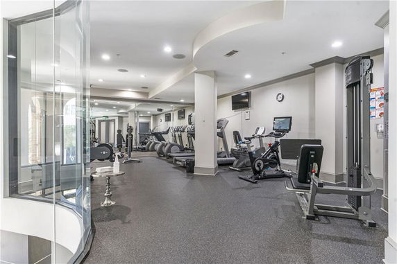Interior view of a gym area with various exercise equipment.